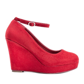 Bombas rojas en la cuña Marni rojo