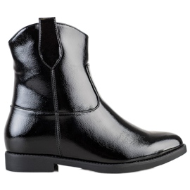 J. Star Vaqueras negras en una cuña negro