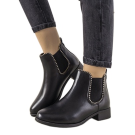 Botines negros clásicos con banda elástica y tachuelas de merino