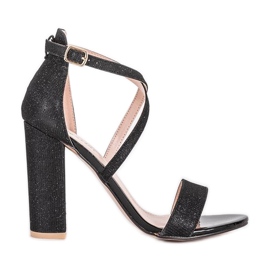 Sandalias negras en un poste Silver Dust negro
