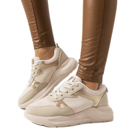 Zapatillas beige con detalles dorados de Davis.
