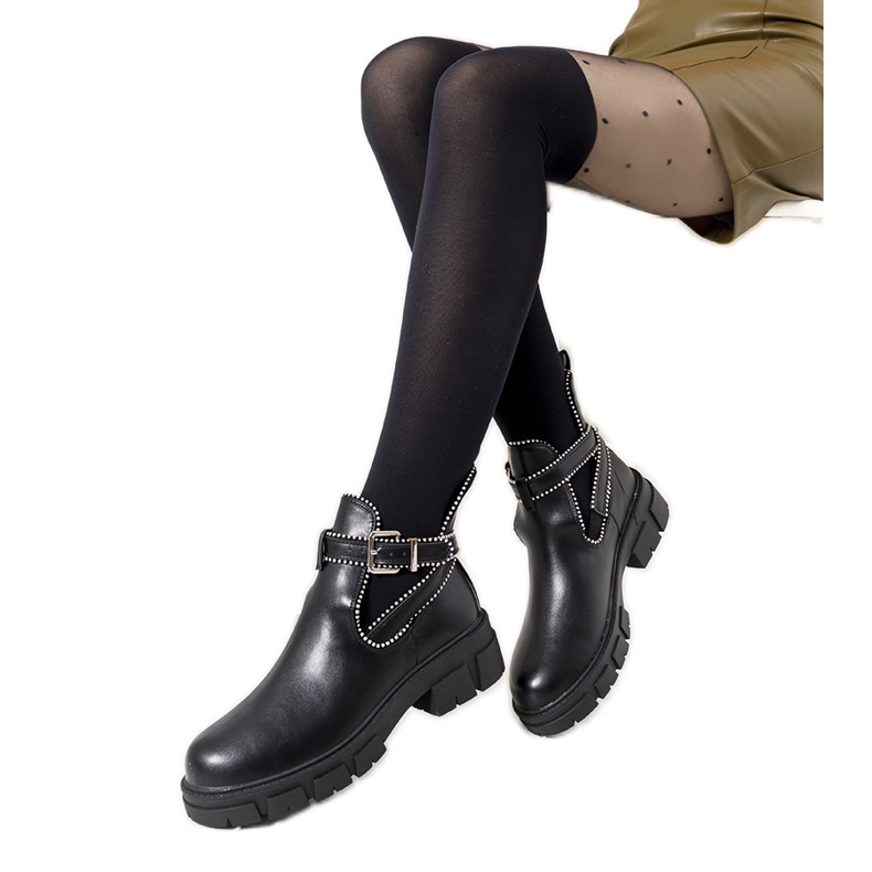 Botas negras en la plataforma Huff negro