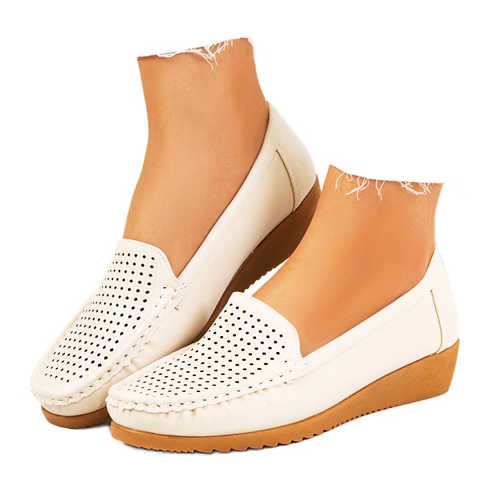 Mocasines beige en el tacón de cuña Dalal