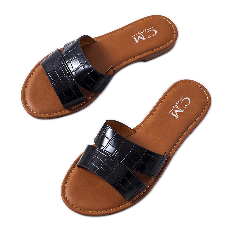 Las elegantes zapatillas negras de Mila negro