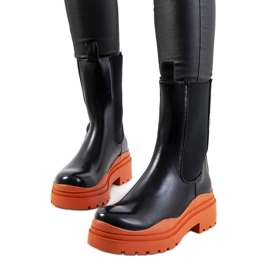 Botines negros con suela Nester naranja
