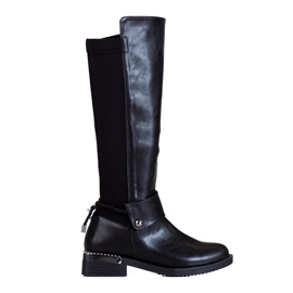 Botas clásicas de mujer en un elegante tacón plano Shelovet. negro