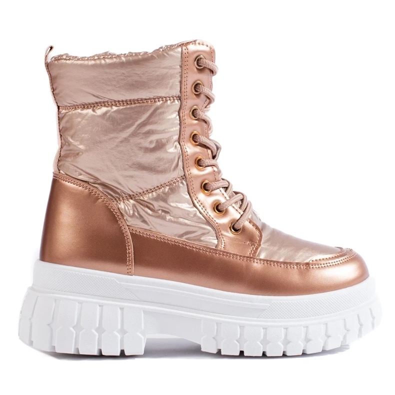 Botas de nieve doradas con cordones para mujer. dorado