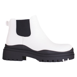 Botas Chelsea de mujer en blanco y negro con plataforma.