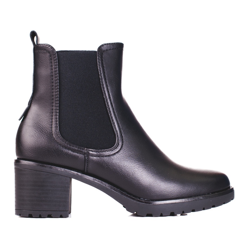 Botas Shelovet Chelsea negras en un poste negro