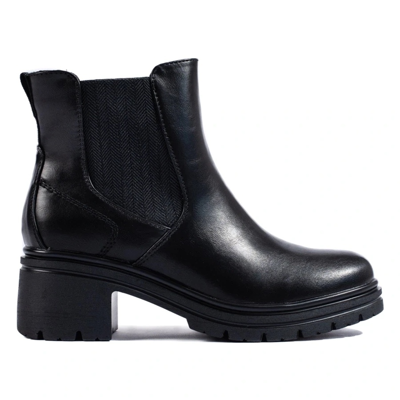 Botines Chelsea negros de mujer en el poste