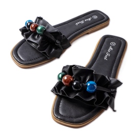 Chanclas con volantes negras de Fortier negro