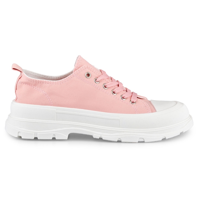 Zapatillas rosas en una plataforma baja. rosado