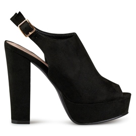 Sandalias negras de tacón con puntera y talón abiertos. negro