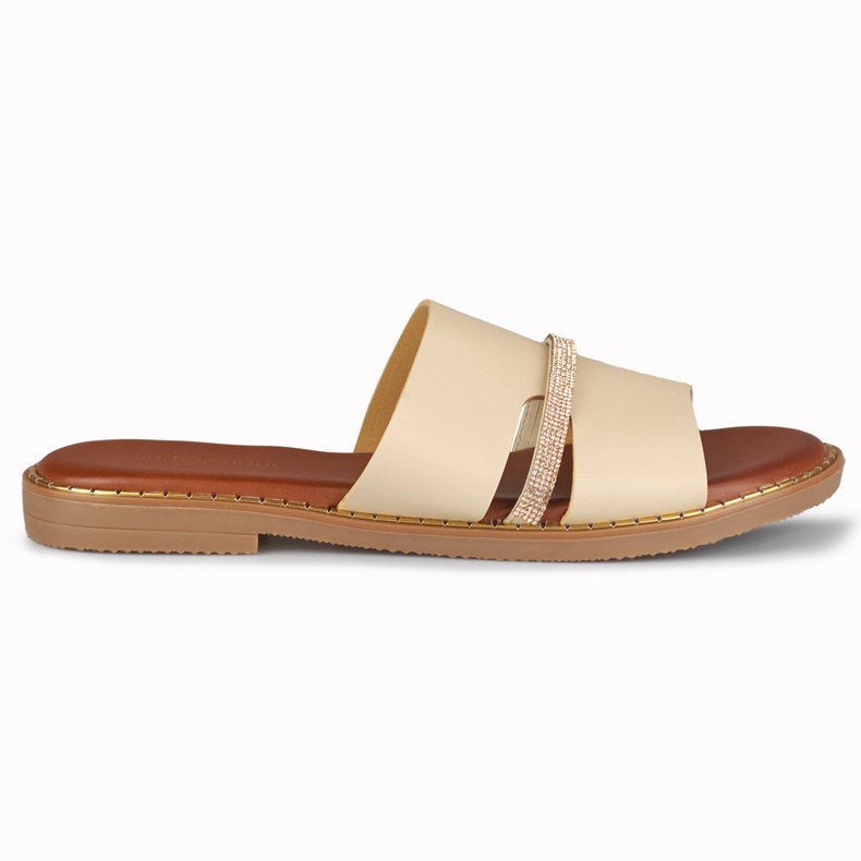 Elegantes zapatillas de mujer beige con decoración.