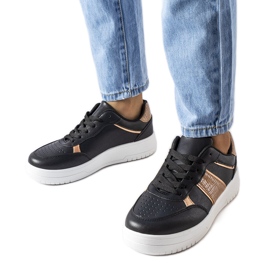 Zapatillas deportivas negras y doradas de Parma. negro