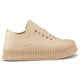 Zapatillas de mujer beige con suela gruesa.