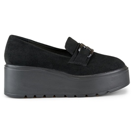 Zapatos cómodos de plataforma de mujer negros.