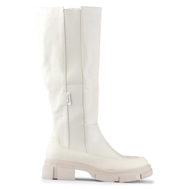 Botas de mujer beige con parte superior flexible.