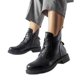 Botas planas asimétricas negras de Solza negro