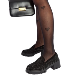 Mocasines negros con un enorme tacón Parent.