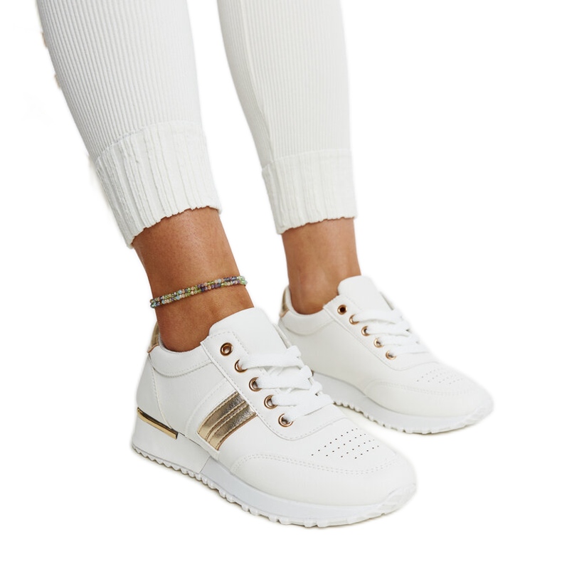 Zapatillas blancas y doradas con plataforma de goma Nihad. blanco