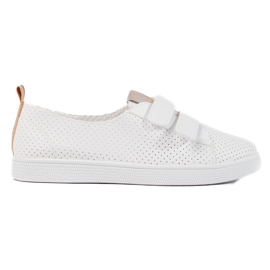Zapatillas blancas de mujer con velcro. blanco