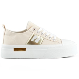 Zapatillas de mujer de moda beige con suela de plataforma gruesa.