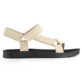 Sandalias deportivas de mujer beige con cierre de velcro.
