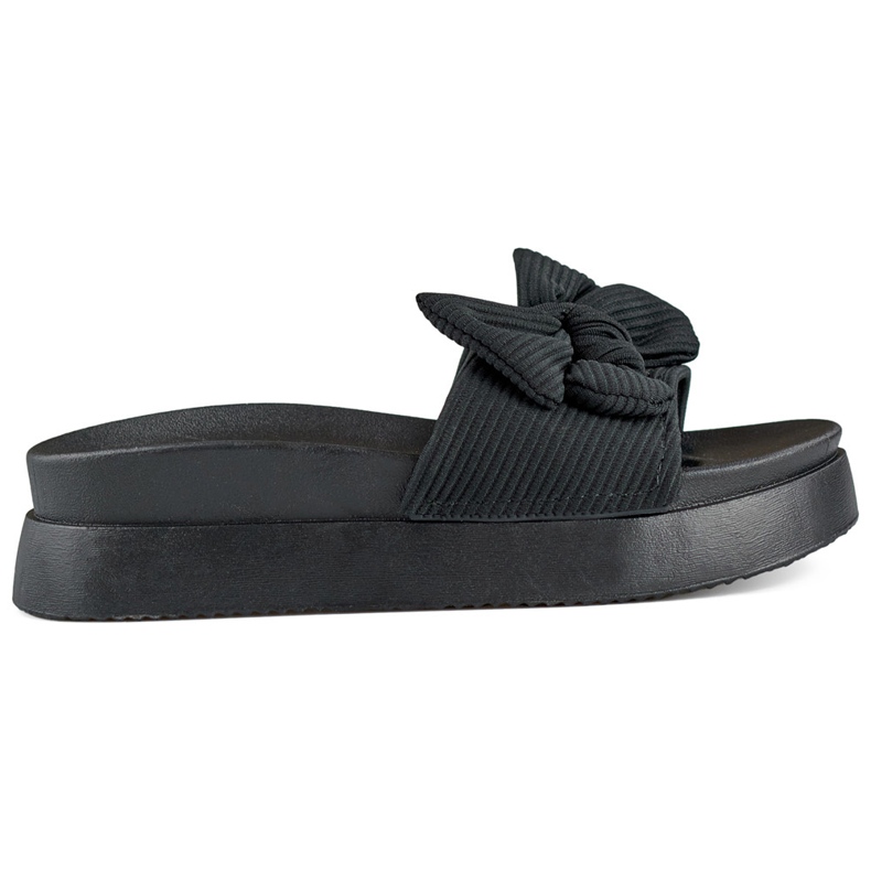 Zapatillas de mujer negras con lazo sobre suela gruesa. negro