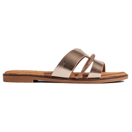 Chanclas doradas elegantes para mujer. dorado