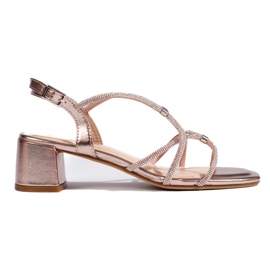 Sandalias de mujer doradas y rosas con tiras decorativas de Sergio Leone rosado