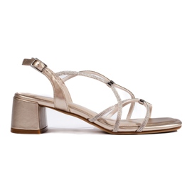 Sandalias doradas de mujer con tiras decorativas de Sergio Leone dorado