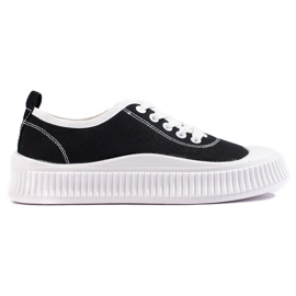 Zapatillas negras de mujer. negro