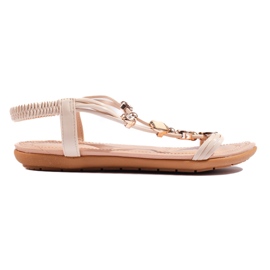 Sandalias planas de mujer beige con adornos