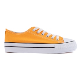 Zapatillas clásicas amarillas con cordones para mujer. amarillo