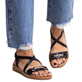 Sandalias negras con hebilla dorada de Pamphila negro