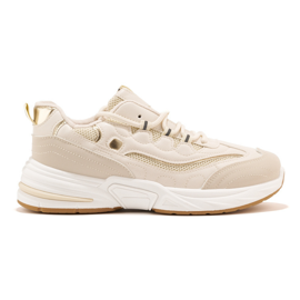 Deportivas de mujer beige con suela gruesa.