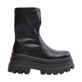 Botines Florinara negros sobre plataforma maciza.