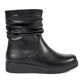 Botines de mujer de piel negra con cuña baja y parte superior con volantes de Sergio Leone negro