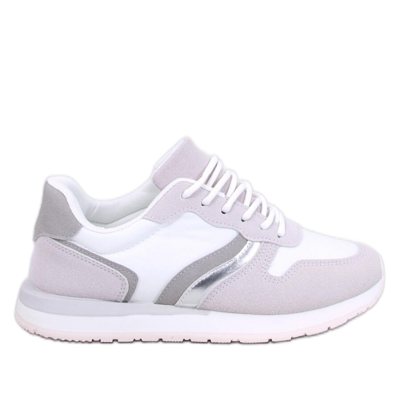 Zapatillas blancas de mujer. blanco