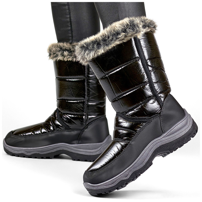 Botas de nieve altas y aislantes de mujer de color negro con pelo negro