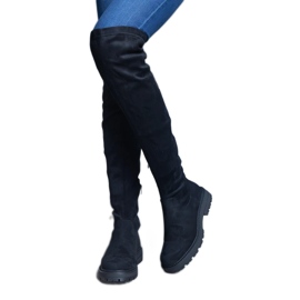 Botas largas negras con parte superior flexible y suela plana. negro