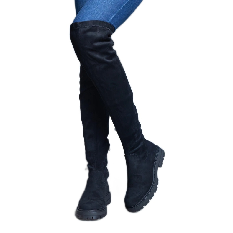 Botas largas negras con parte superior flexible y suela plana. negro