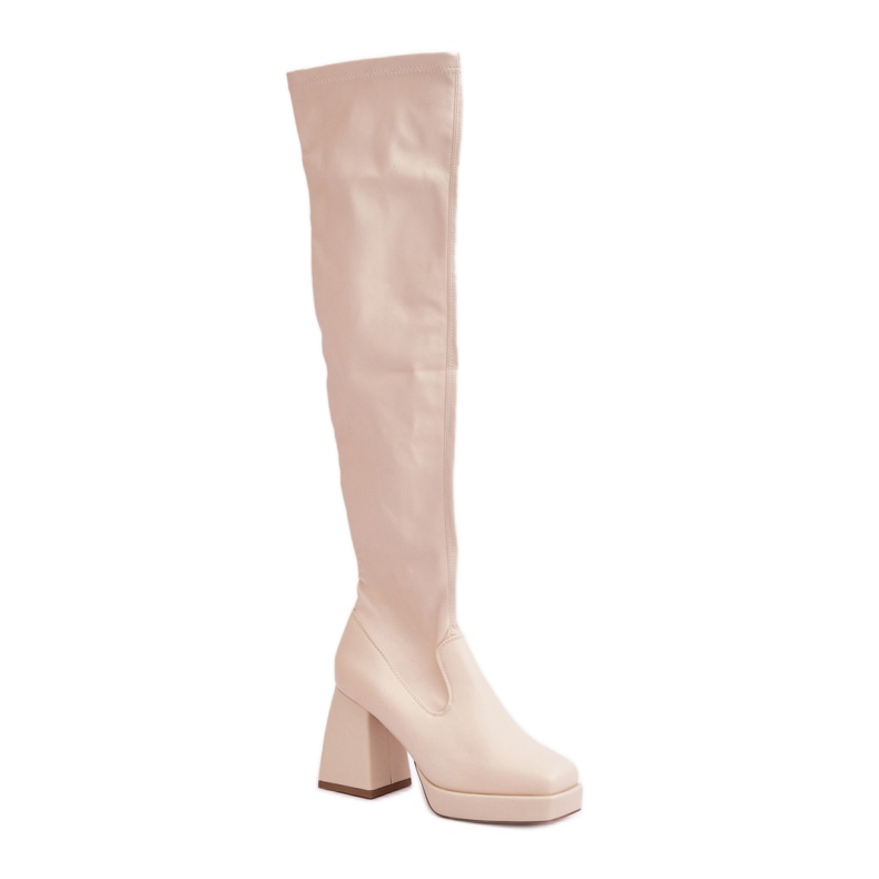 Botas de mujer beige claro con tacones estables.