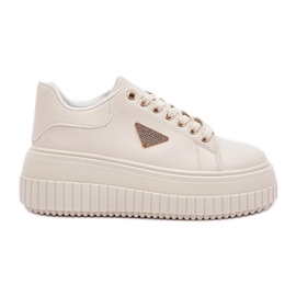 Zapatillas elegantes en una plataforma beige ligera masiva