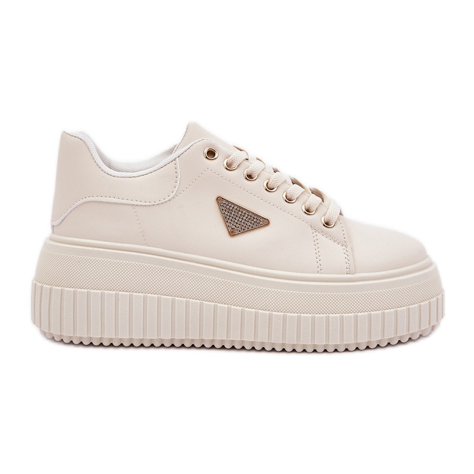 Zapatillas elegantes en una plataforma beige ligera masiva