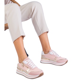 Zapatillas de deporte de deportes rosa en la plataforma con una inserción dorada rosado Zapatillas de deporte de deportes rosa en la plataforma con una inserción dorada rosado