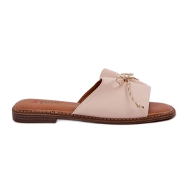 Suelas planas con un arco beige decorativo