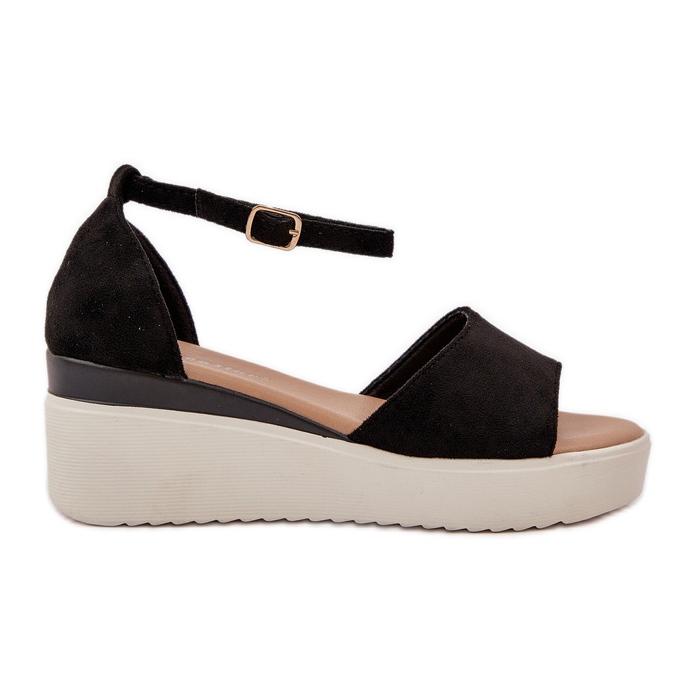 Sandalias de luz en la plataforma y delicadas cuñas negras negro