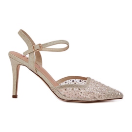 Tacones decorados con un tacón de oro abierto dorado Tacones decorados con un tacón de oro abierto dorado